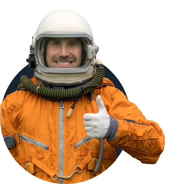 A man in an orange jacket and helmet giving a thumbs up